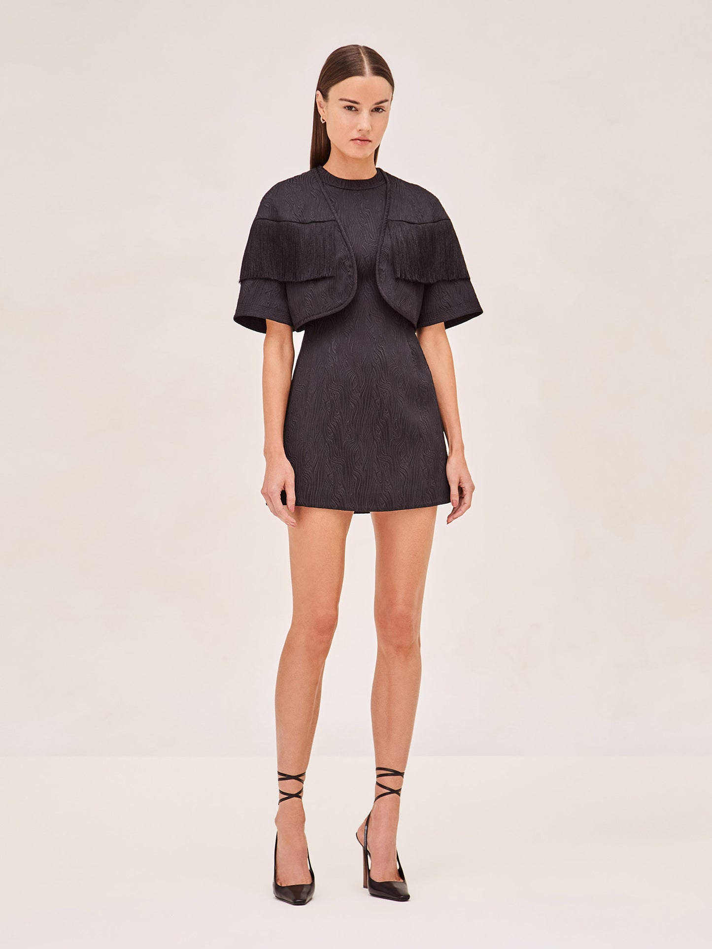Alexis Andria sleevless mini dress in black. with taddeo fringe jacket 