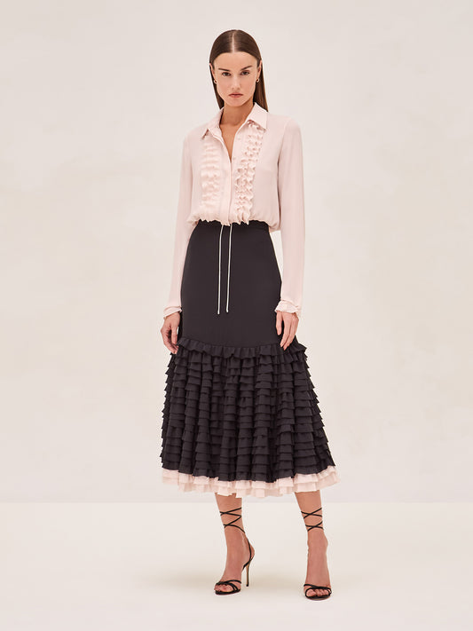 ALEXIS black midi skirt with ruffle tier detailing and a blush tier at the bottom. 