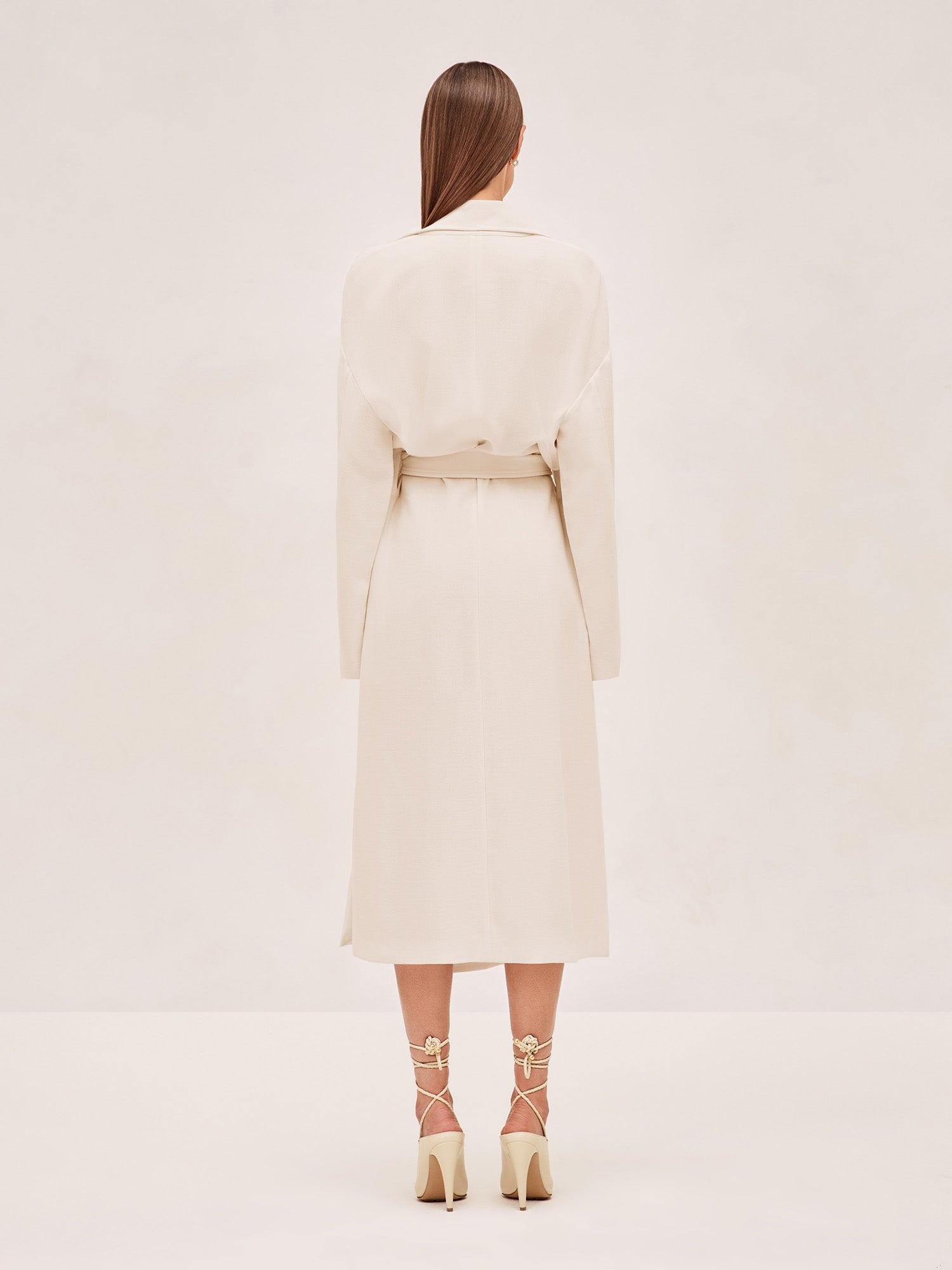 ALEXIS EAST MIDI COAT IN IVORY WITH SASH BELT.