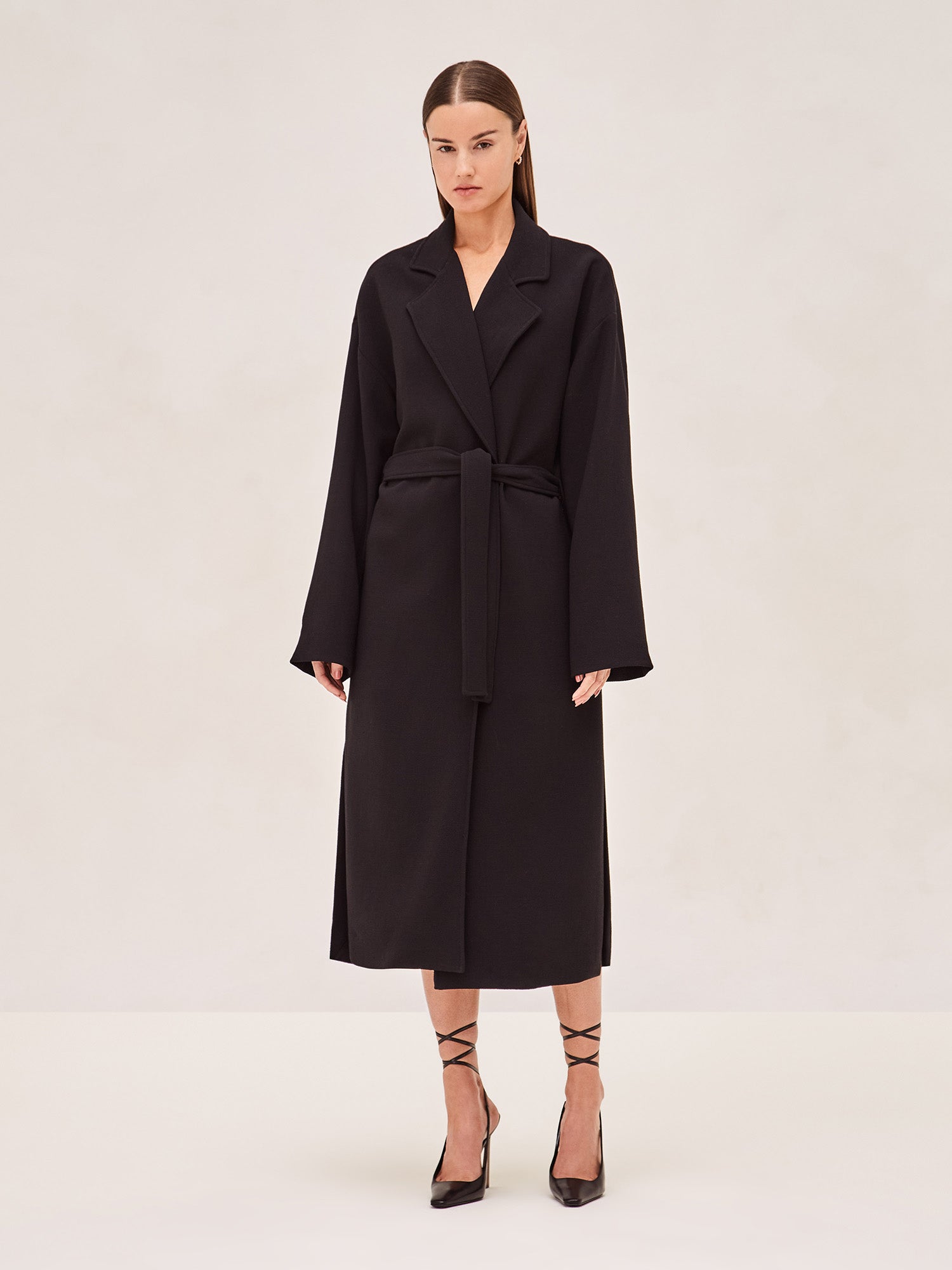 ALEXIS EAST MIDI COAT IN BLACK WITH SASH BELT.