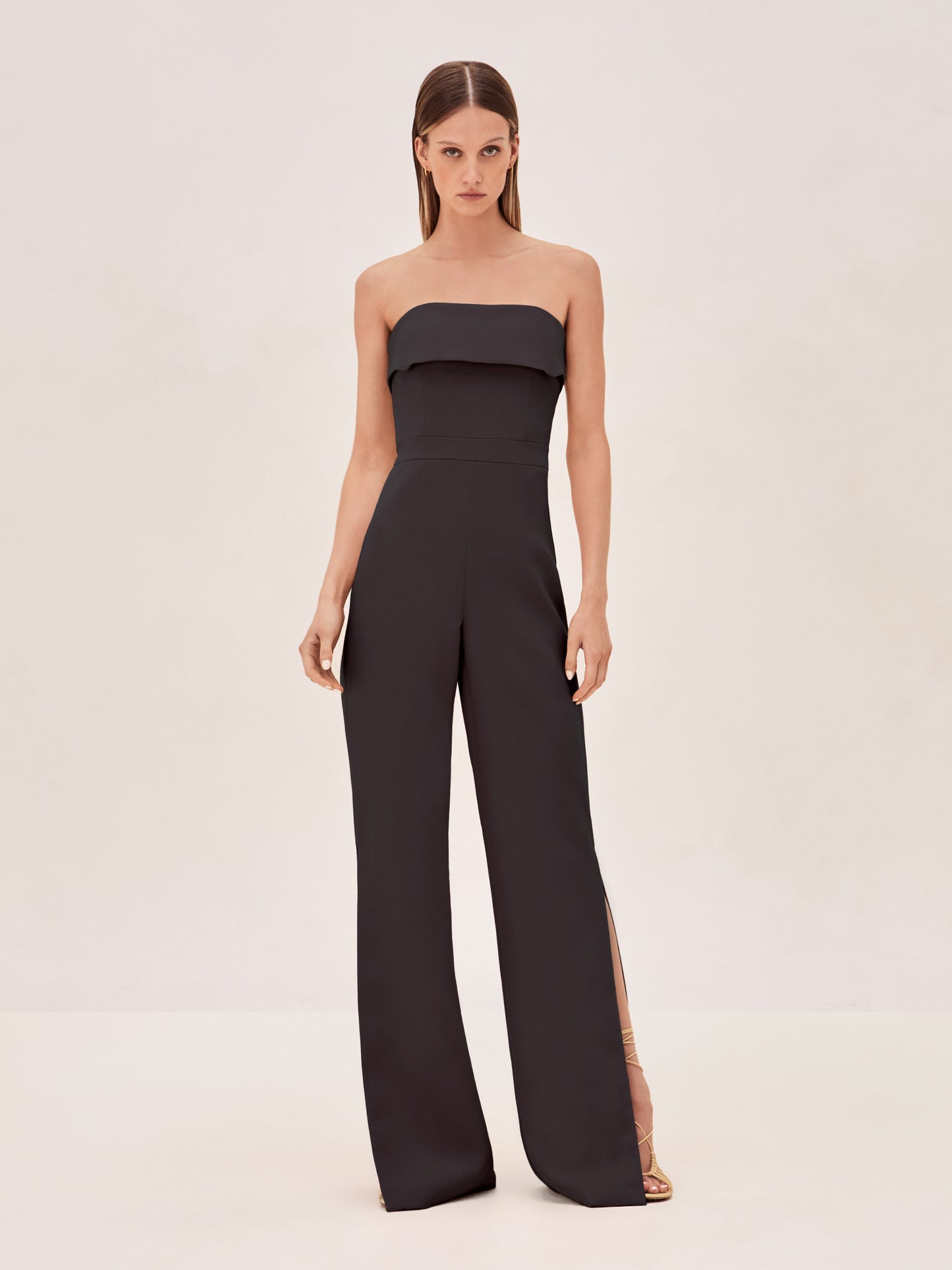 ALEXIS Strapless kaye jumpsuit in black with slit on pant leg