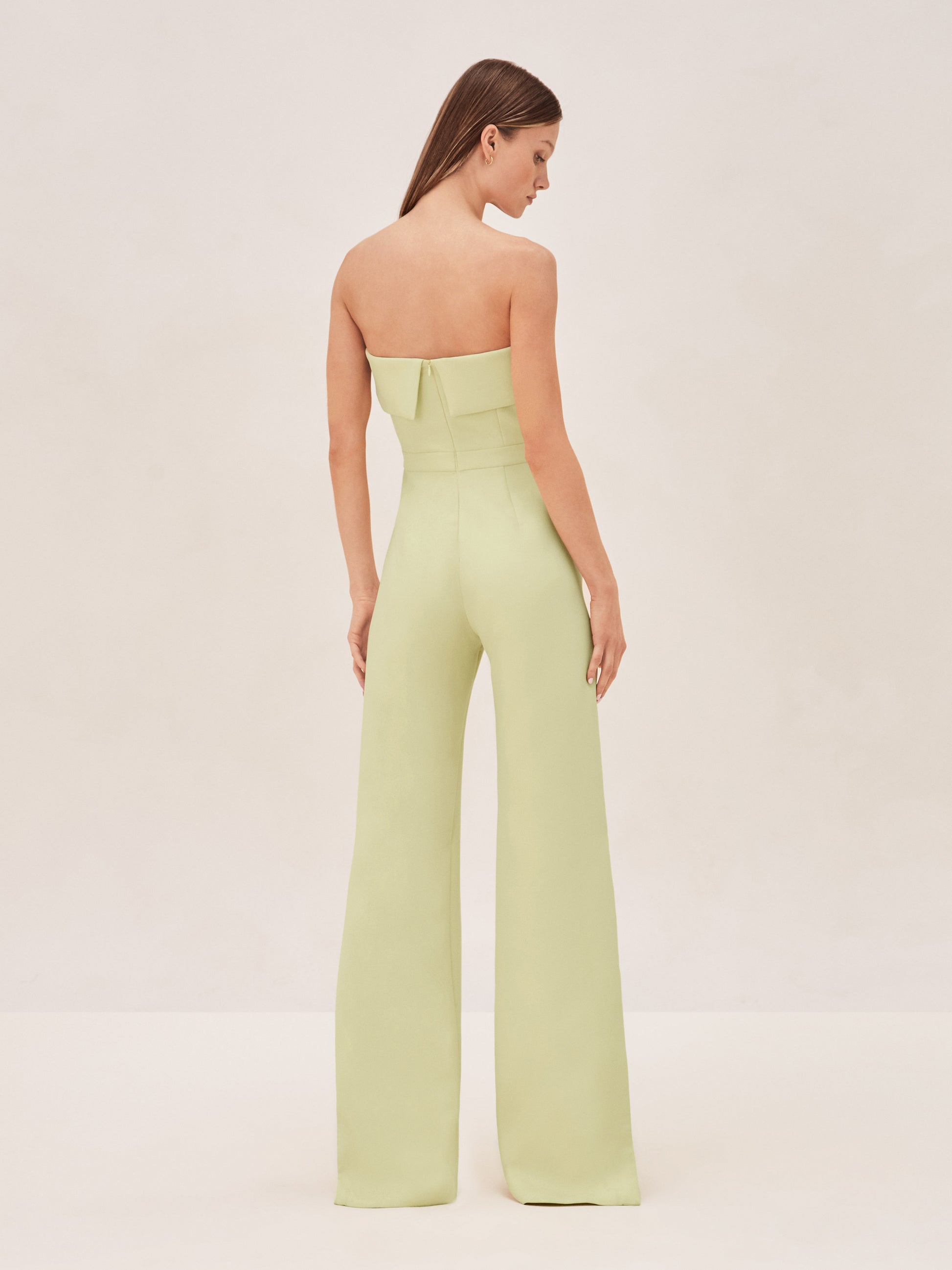 ALEXIS Strapless kaye jumpsuit in limelight green with slit on leg back image