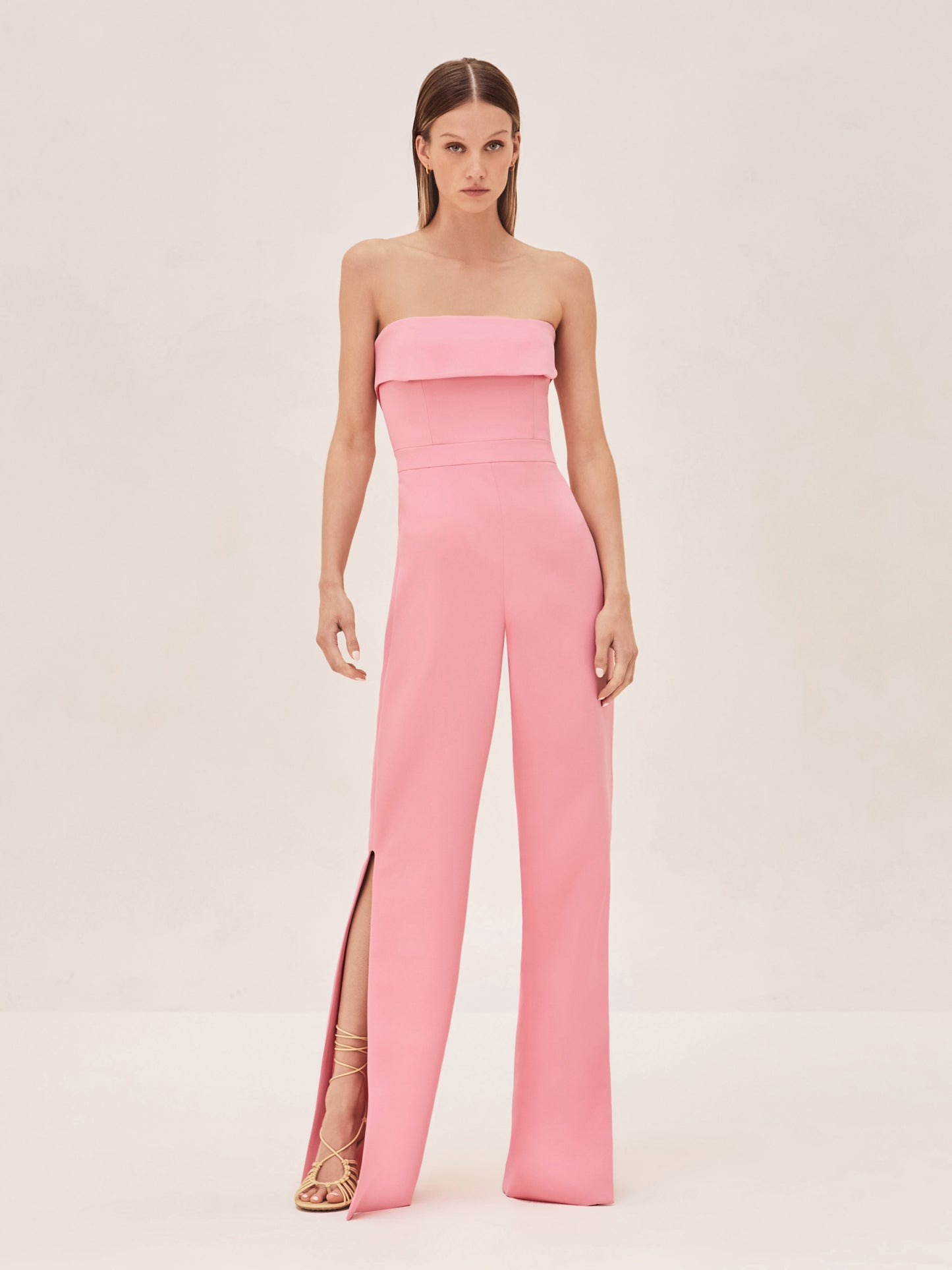 ALEXIS Strapless kaye jumpsuit in pink with slit on leg