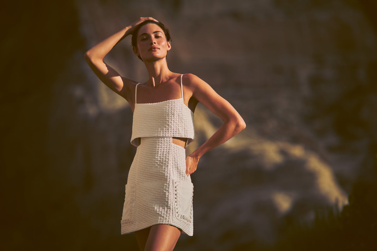 ALEXIS Linzy mini dress with side cutouts in white. campaign image 