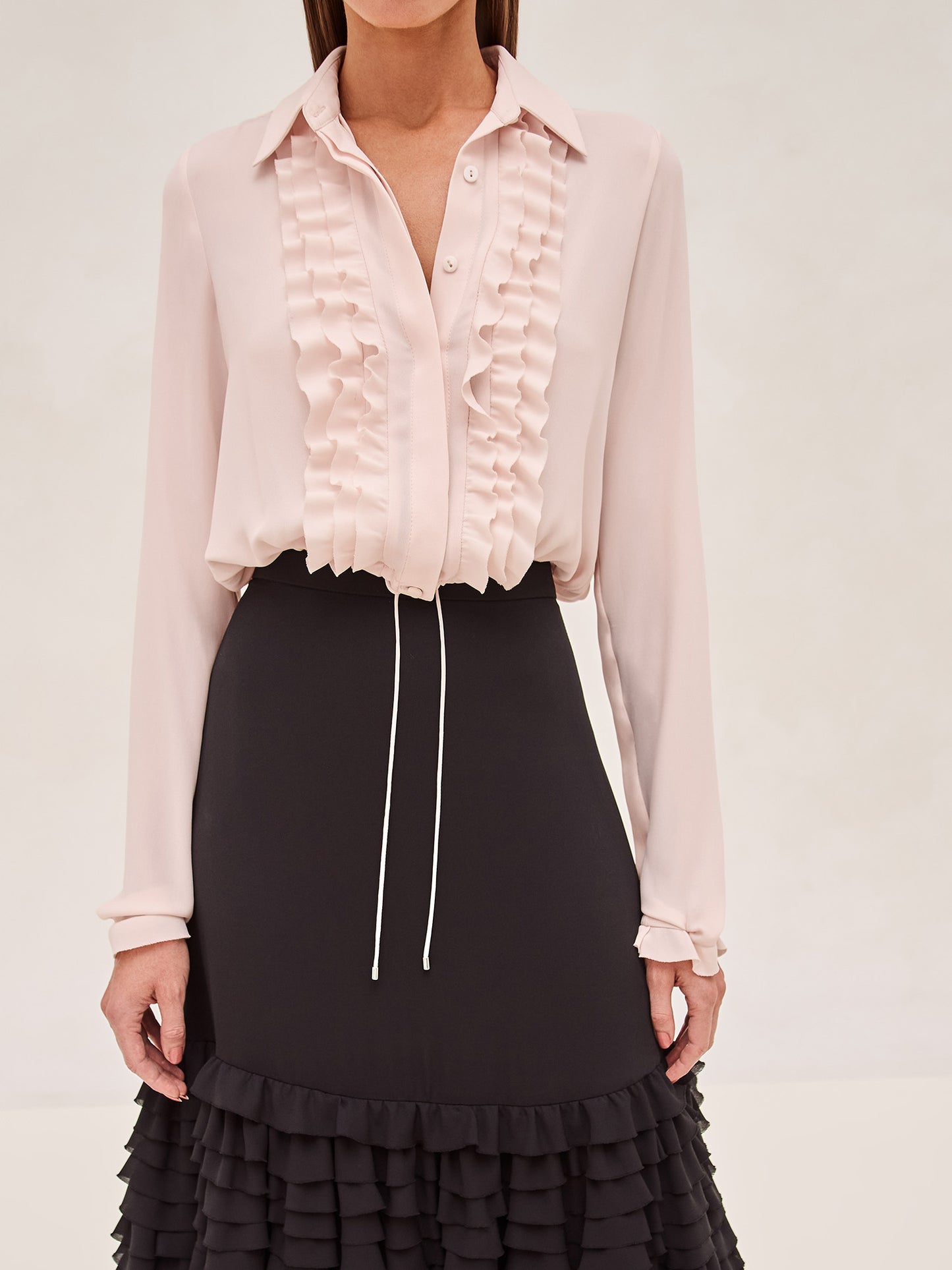 ALEXIS black midi skirt with ruffle tier detailing and a blush tier at the bottom. 