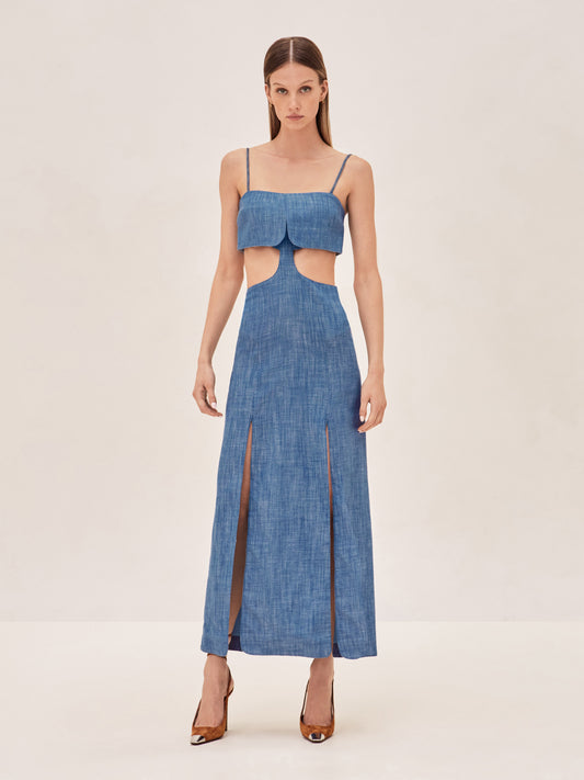 ALEXIS Denim sleevless maxi dress with side cut outs and slits up the front.